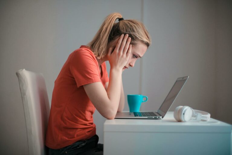 Young woman searching for the information about an employer.